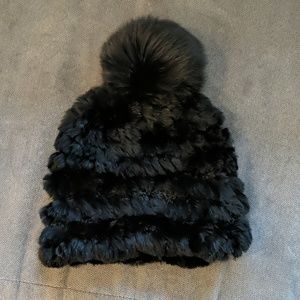 Mitchie's black rabbit fur hat.